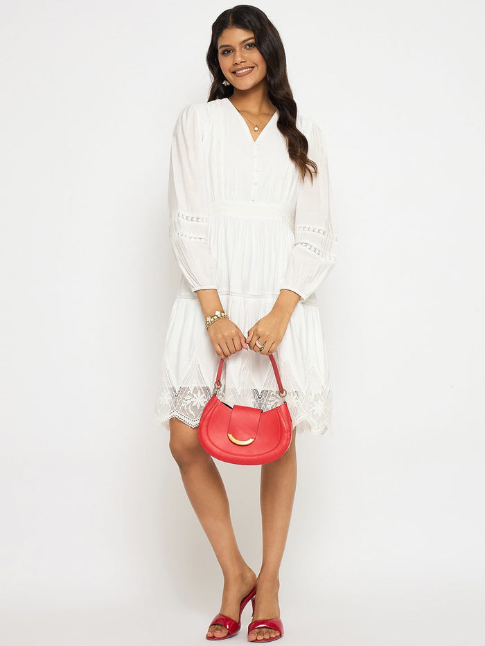 Woman holding a pink handbag against a white background