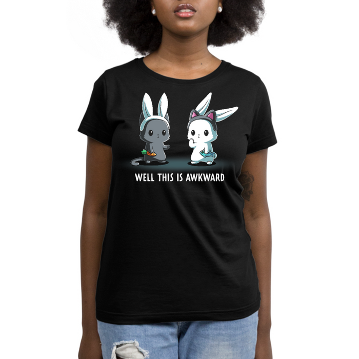 Premium Cotton T-shirt_TeeTurtle black Well This Is Awkward Premium Cotton T-shirt featuring a a cat in bunny ears holding a carrot and a bunny in cat ears holding a piece of fish. Both look unsettled. Text at the bottom reads "Well This Is Awkward"